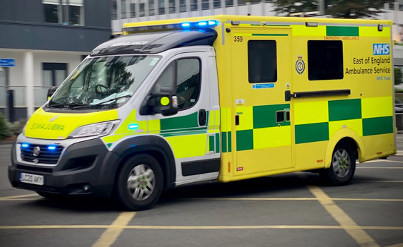 EEAST Ambulance driving down the street with blue lights flashing
