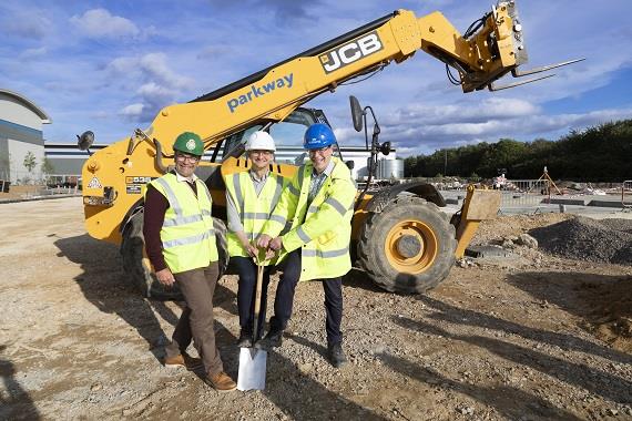 Tom Abell (centre) breaks ground at the development at a new  ambulance hub in Bury St Edmunds