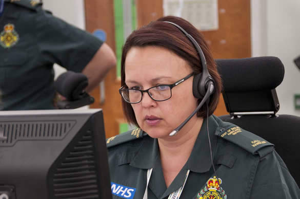 999 Call Handler on headset in front of computer screen