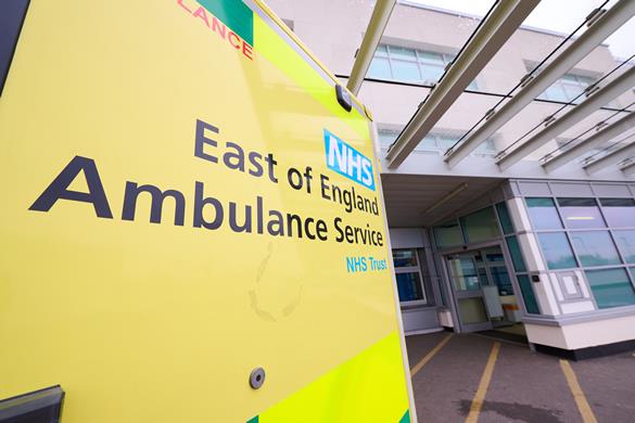 EEAST logo on the side of an ambulance, outside a hospital